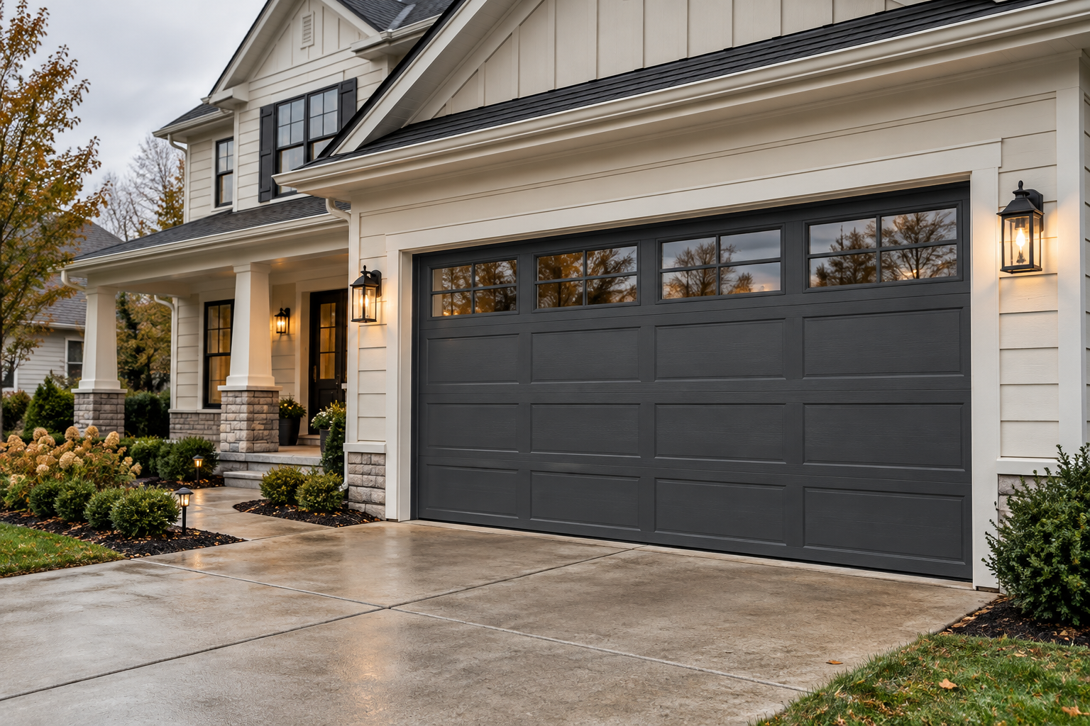 A charcoal sectional garage door on a suburban home